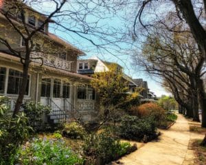 a neighborhood with trees and sidewalk