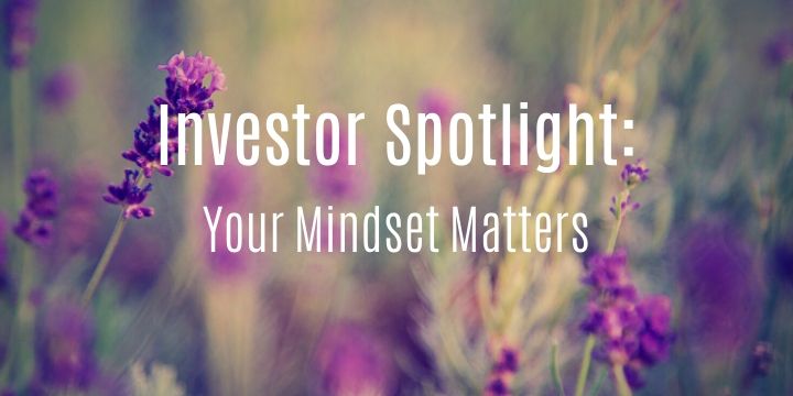 Purple flowers with blurred background and text overlay: "Investor Spotlight: Your Mindset Matters.