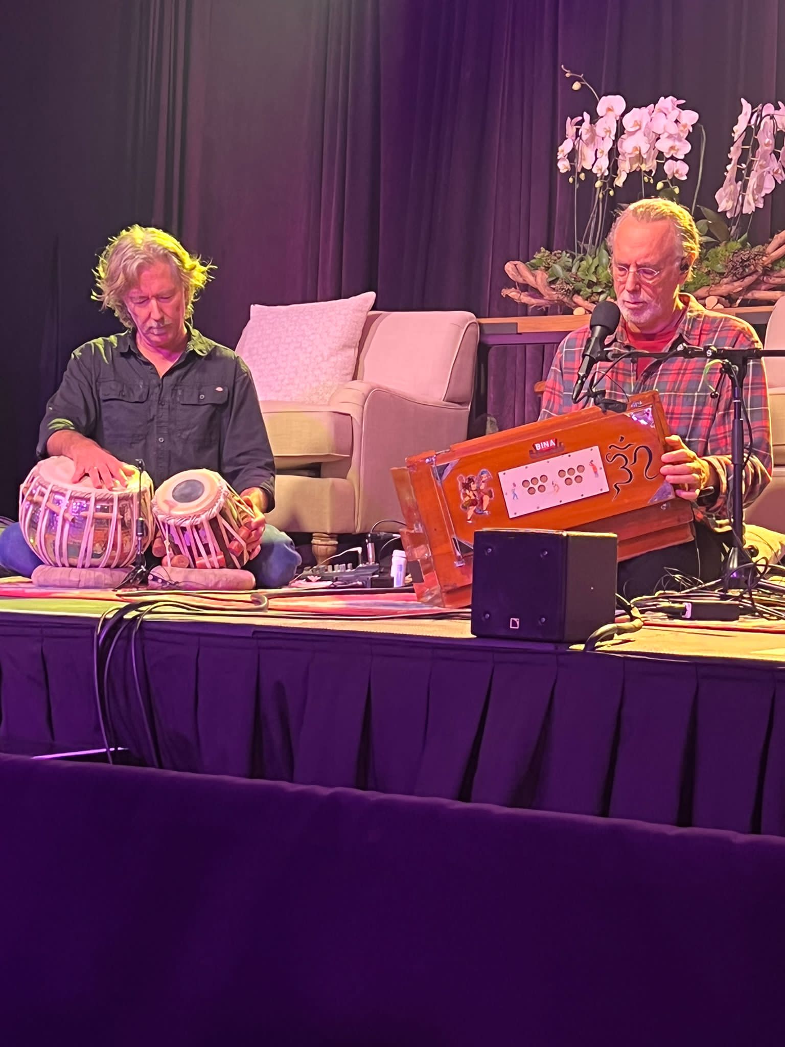 Krishna Das speaking at happiness seminar