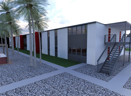 A modern two-story building boasts large windows and exterior stairs, surrounded by palm trees on a gravel landscape, inviting future purchases.