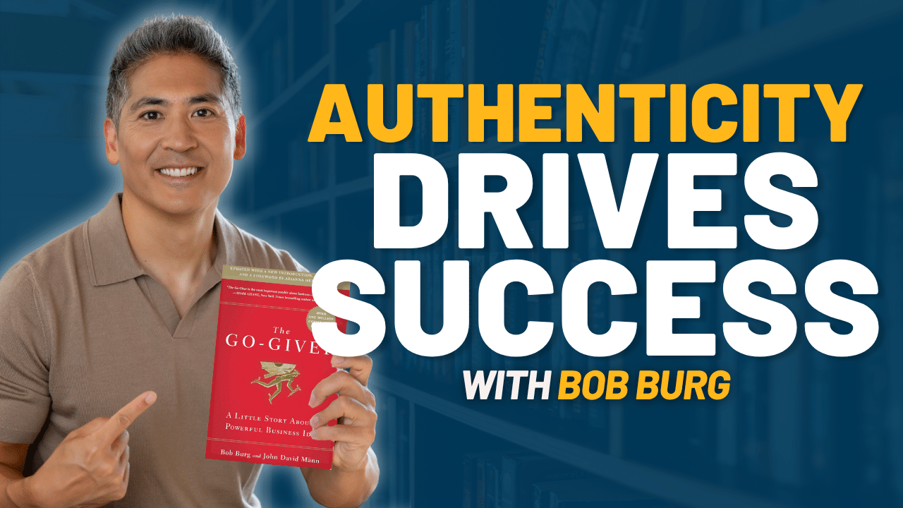 A man smiles and points to a book titled "The Go-Giver" with the text "Authenticity Drives Success with Bob Burg" displayed beside him.