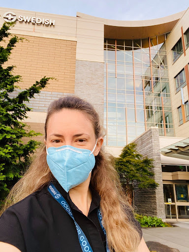 Physician in a mask outside Swedish hospital on the day she made clinical work optional